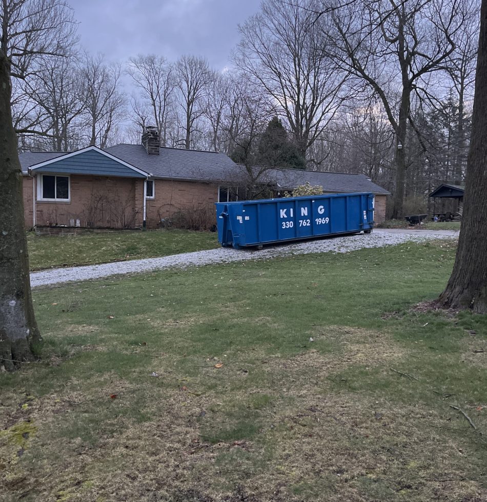 30 yard roll off dumpster in the driveway of a customers home in canton, ohio