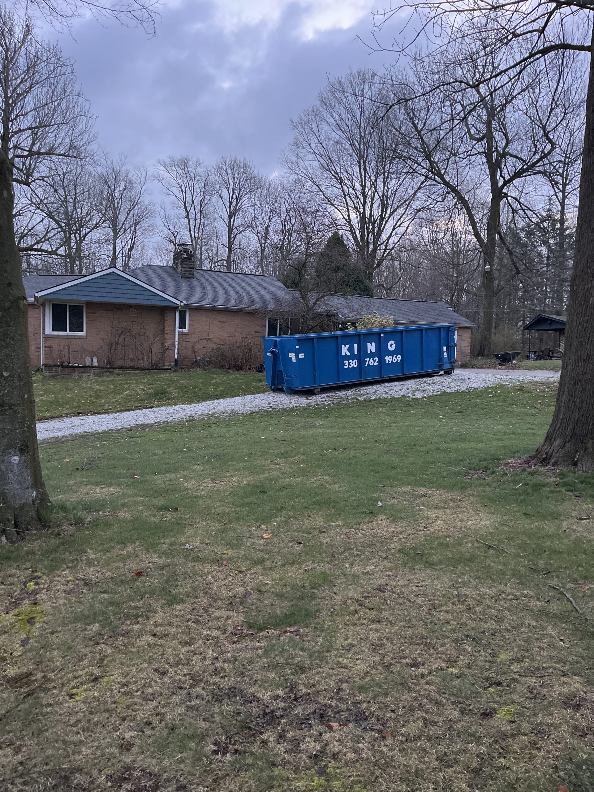 30 yard roll off dumpster in the driveway of a customers home in canton, ohio