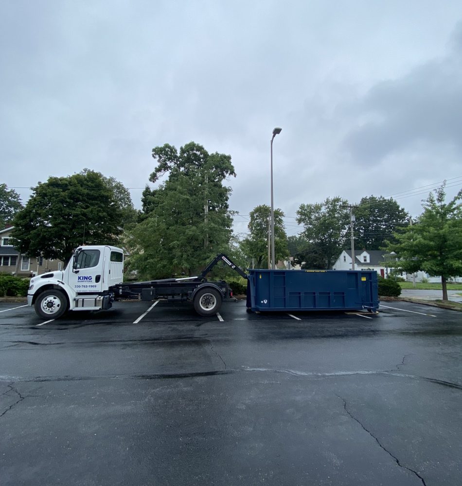 20 yard being delivered to parking lot by King Dumpsters in Akron, Ohio